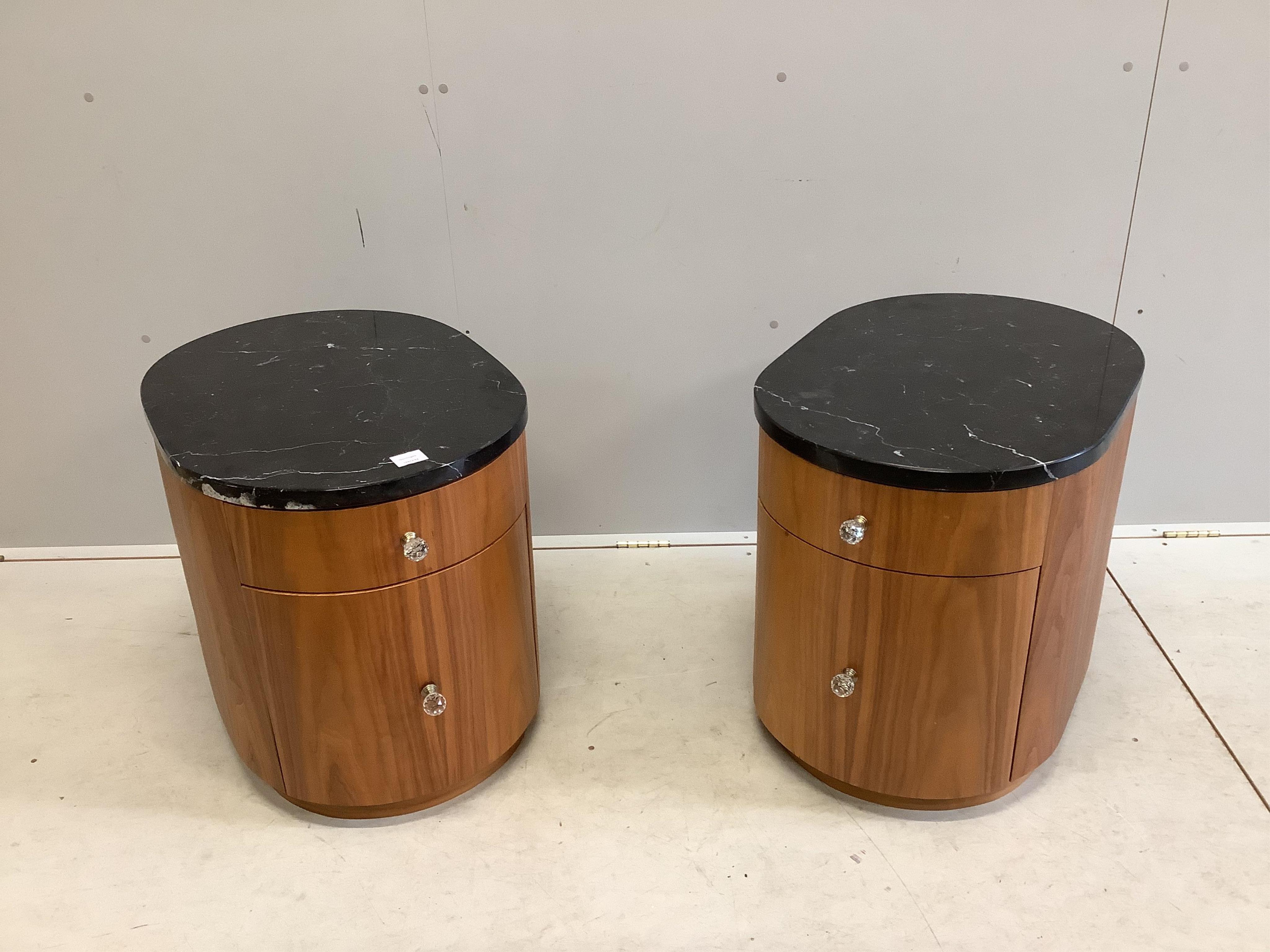 A pair of Contemporary black walnut and marble bedside cupboards, width 49cm, depth 67cm, height 56cm. Condition - fair to good